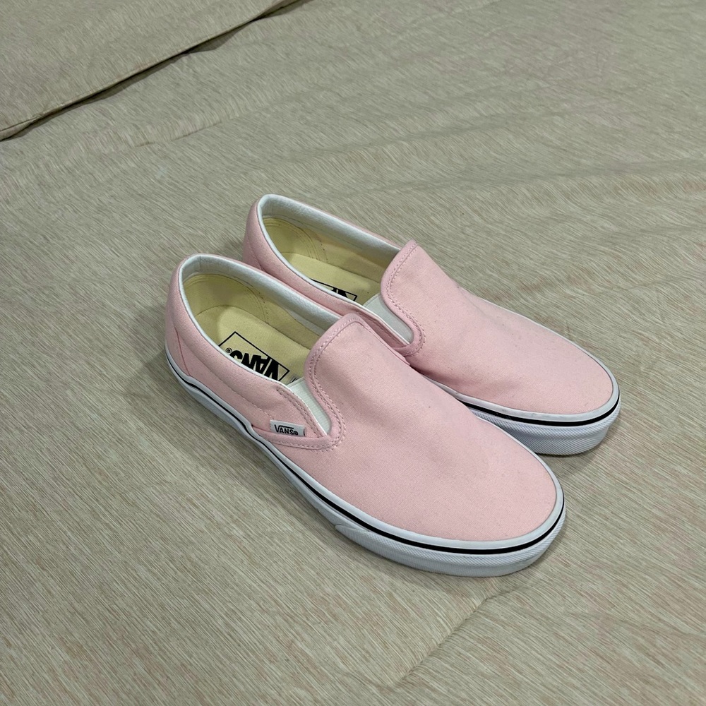 Pink Vans Slip-ons only worn twice. No rips or holes. In great condition.